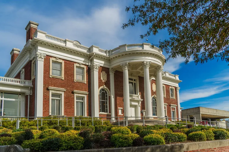 A stately brick mansion with white columns in Chattanooga, Tennessee